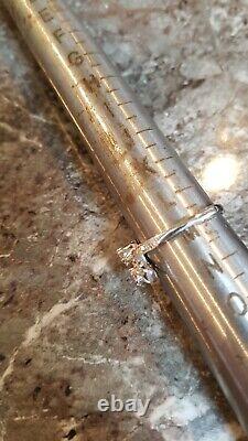 18ct White Gold & Diamond Tied Bow Ring. M. Refxcood