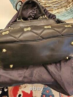 Betsey Johnson Black Lamb Skin Quilted Handbag With Bow-tied Gold Accents