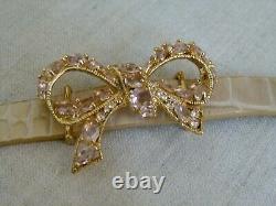 Les Nereides beige leather bracelet with golden bow and pink crystals