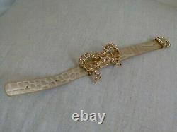 Les Nereides beige leather bracelet with golden bow and pink crystals