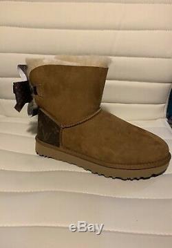 New Ugg Boot With Louis Vuitton canvess on heel. Handmade LV Bow. Size 8