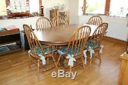 Solid Oak Amish Dining Table and 6 Bow Back Chairs expands 6 to 9 feet