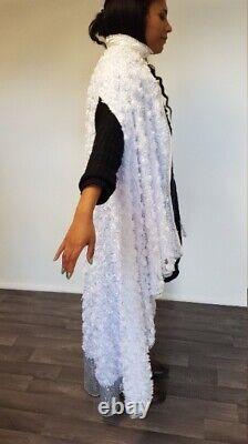 Unique one off hand made cape in white 3d floral lace fabric. Buckle fastening