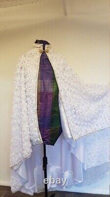 Unique one off hand made cape in white 3d floral lace fabric. Buckle fastening